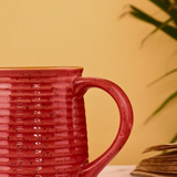 Glossy red ceramic coffee mug