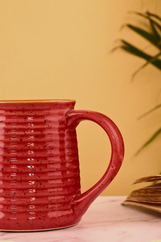 Glossy red ceramic coffee mug