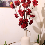 Red dried flower bouquet on table