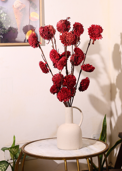 Red dried flower bouquet on table