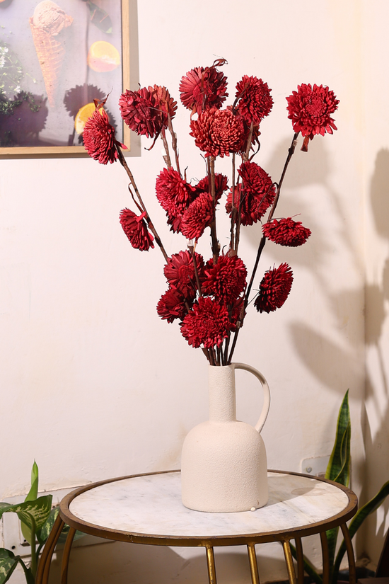Red dried flower bouquet on table