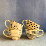 black & white mugs made by ceramic 