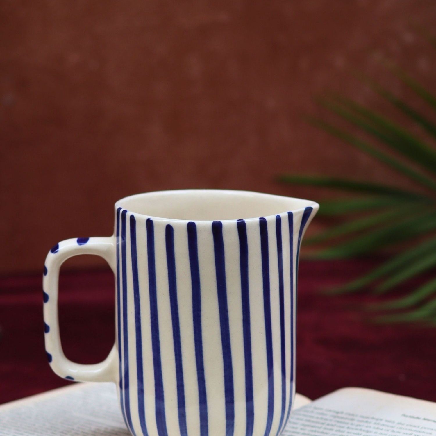 Blue striped jug made by ceramic
