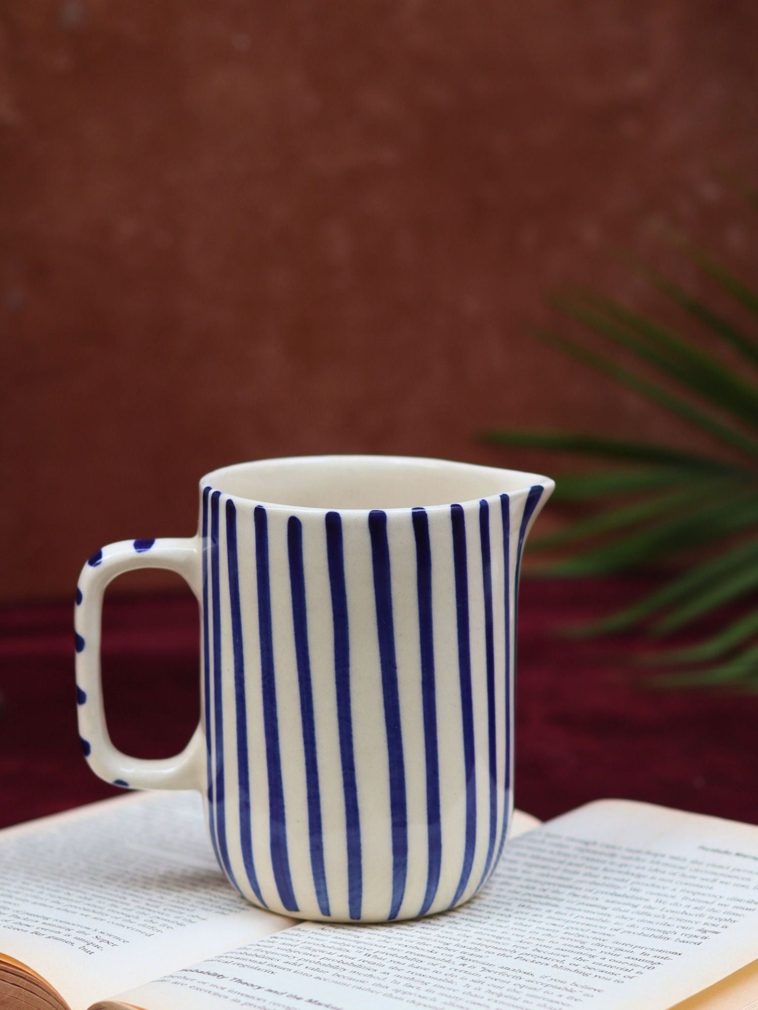 Blue striped jug made by ceramic