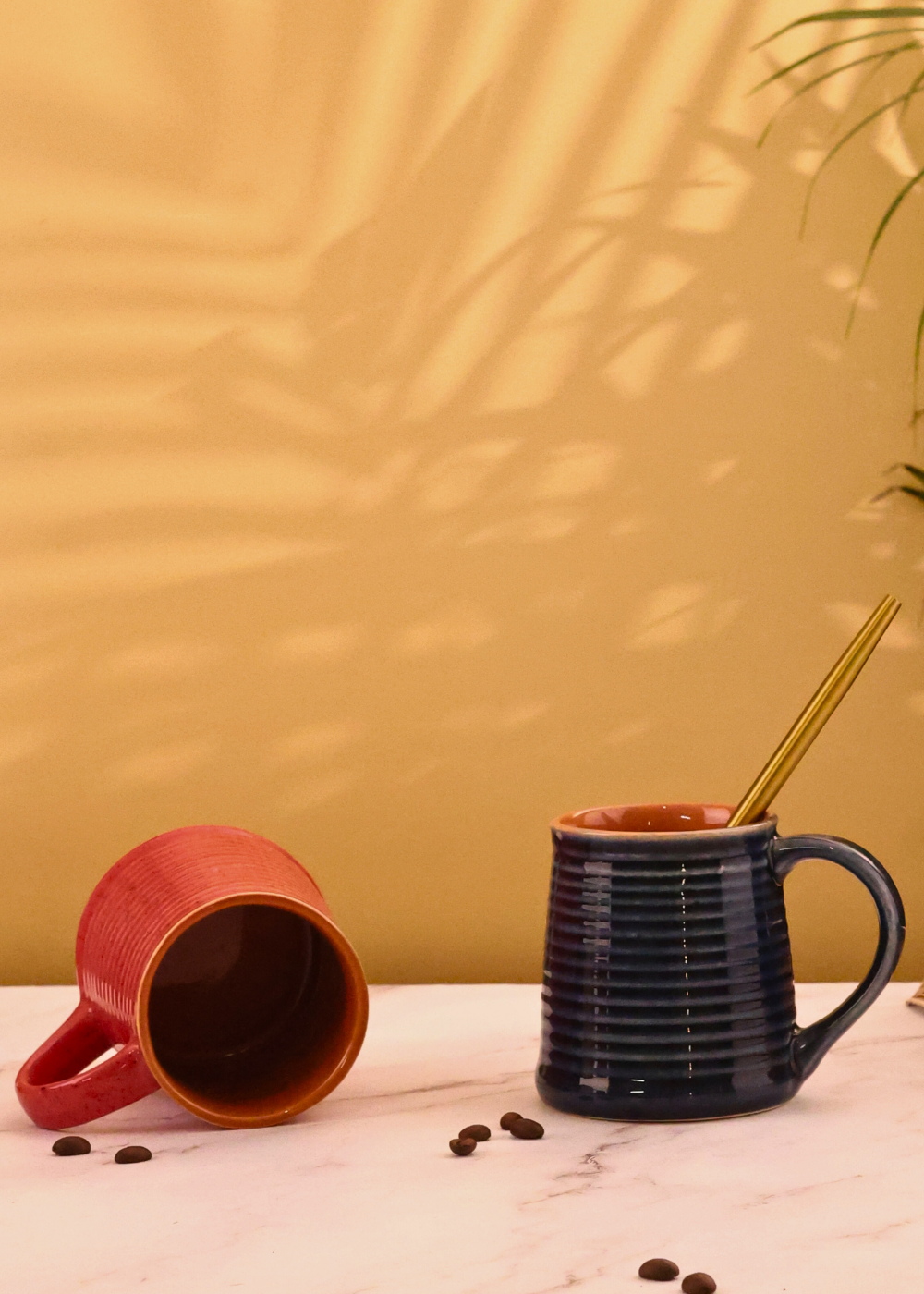 red & blue coffee mug made by ceramic 