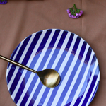 Handmade ceramic blue plate with spoon