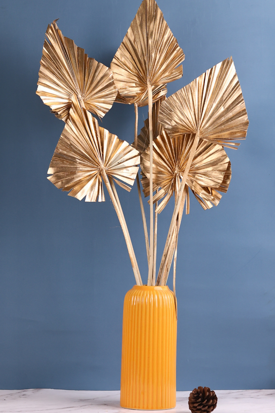Dried gold palm bouquet with yellow vase
