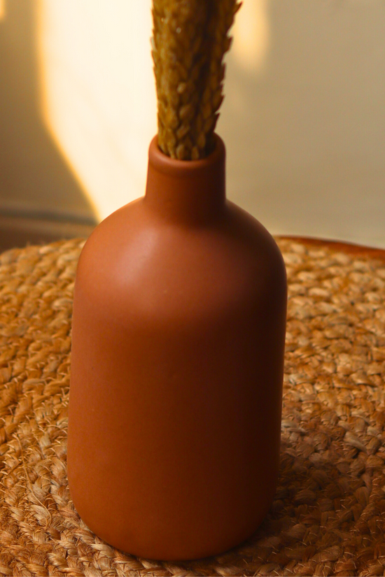 Caramel vase on mat