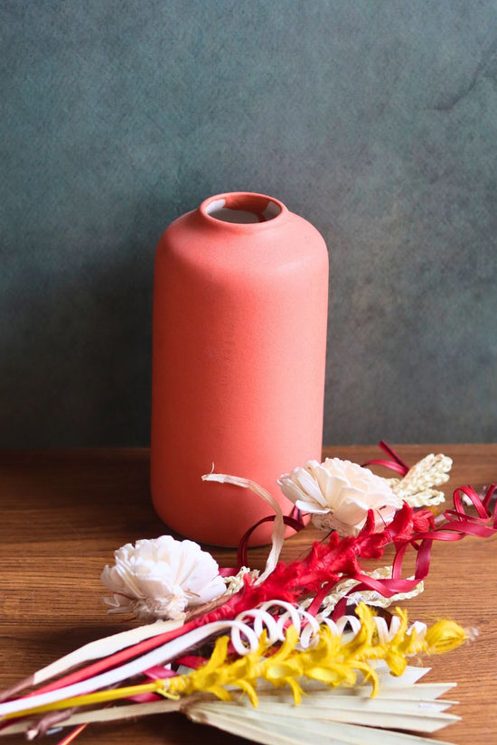 this orange bloom vase with asoorted bunch combo made by handcrafted