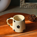 Ceramic coffee mug on a wooden tray