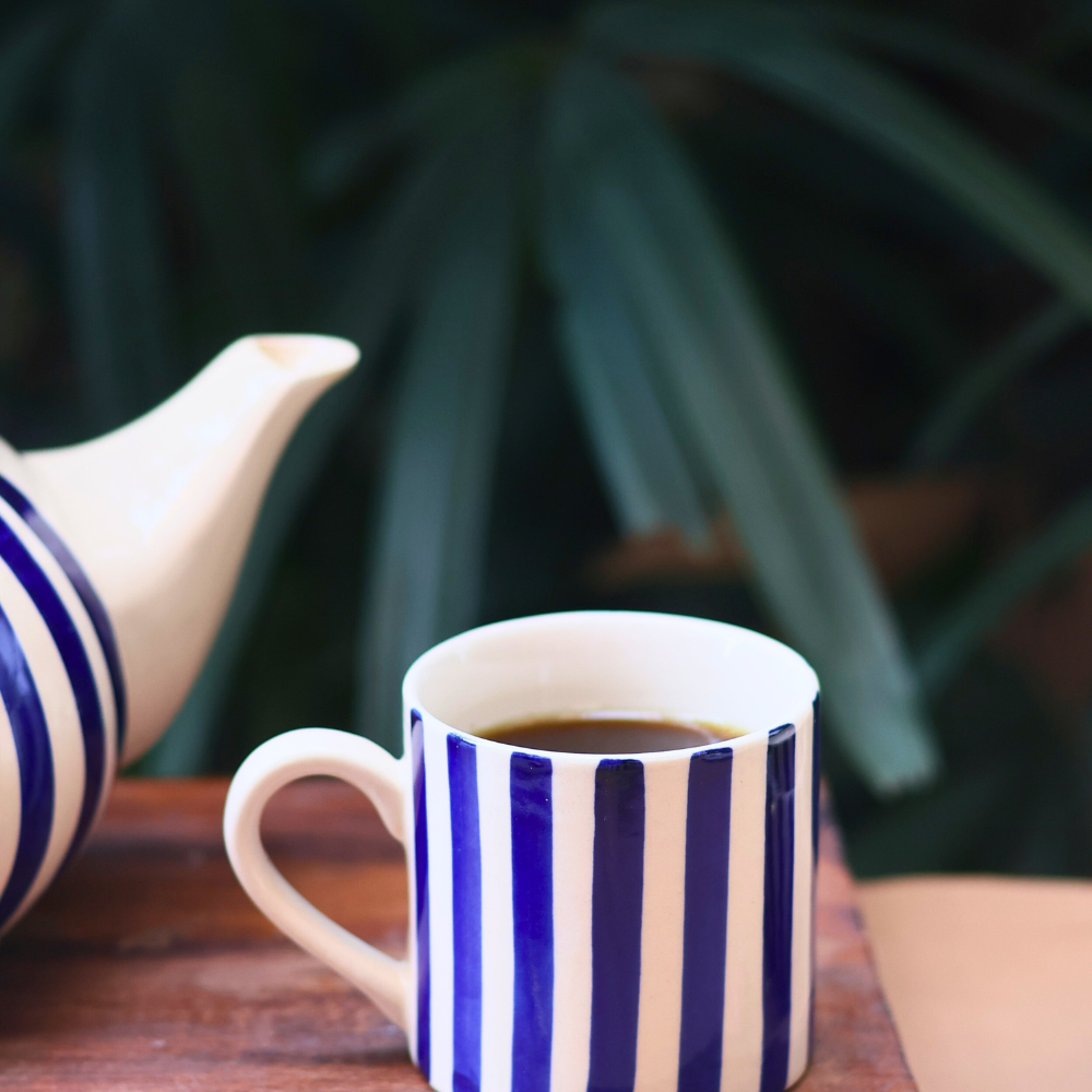 Handmade ceramic tea cup with tea 
