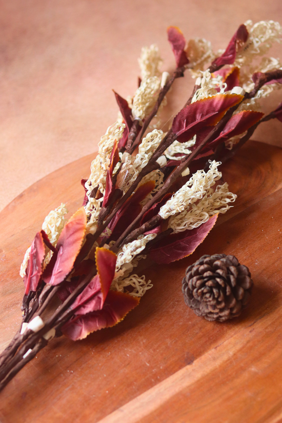 Dried flower bunch laying on a wooden surface