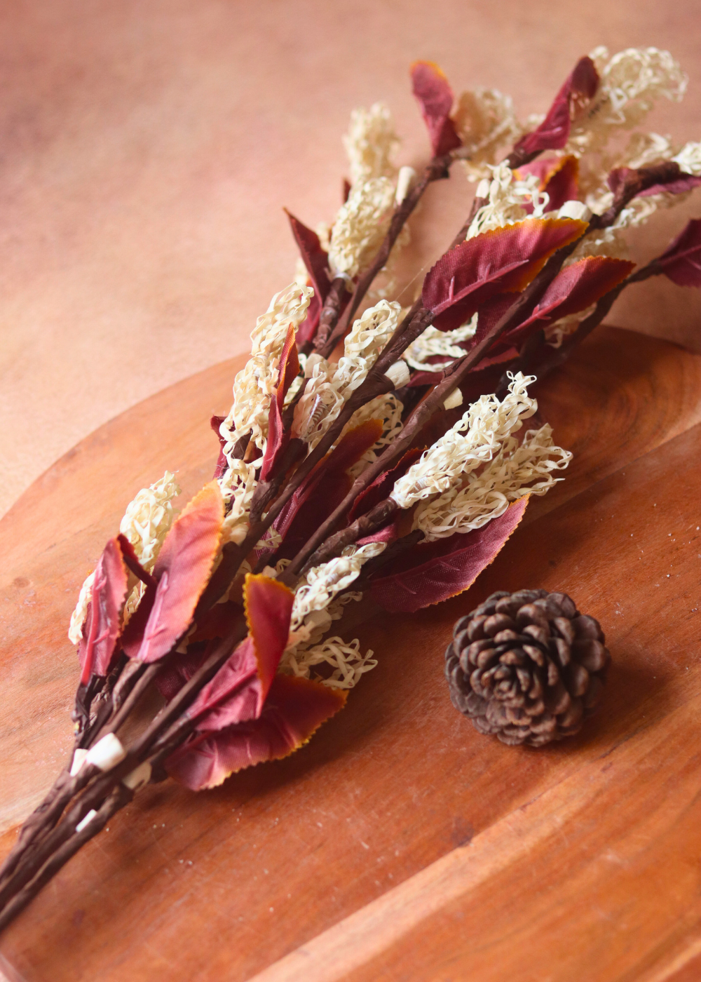 Dried flower bunch laying on a wooden surface