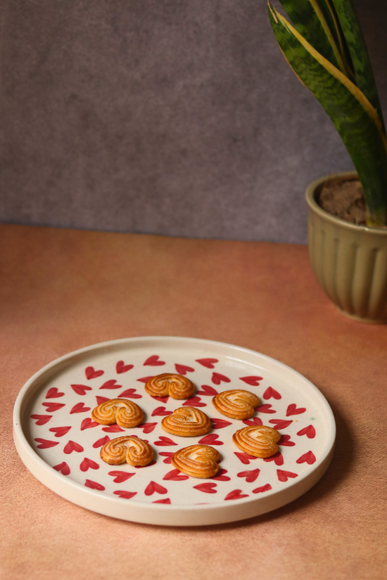 Red hearts handmade ceramic platter with biscuits 