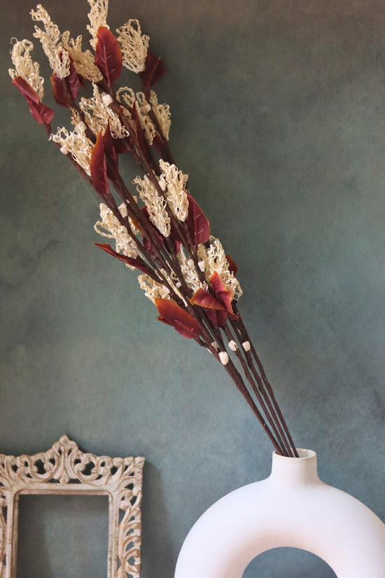 Dried flowers bouquet in white vase