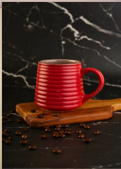 Hot red coffee mug with beans 