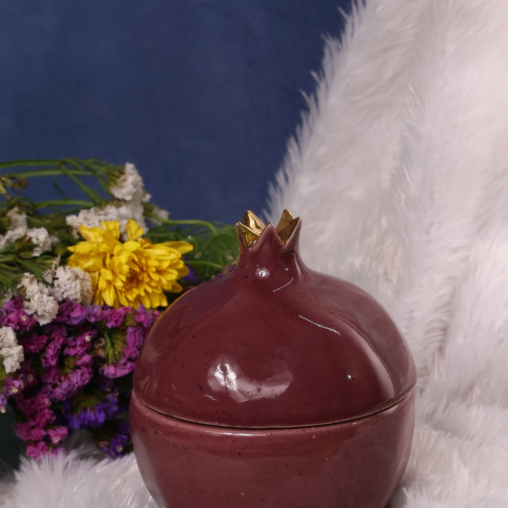 Anar jar on a white cloth with flowers