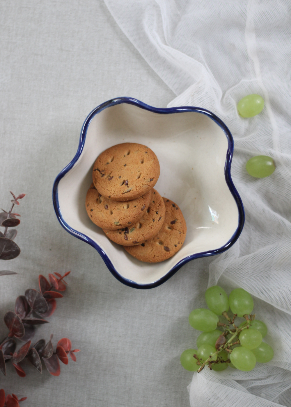 Handmade ceramic curvy bowl with cookies