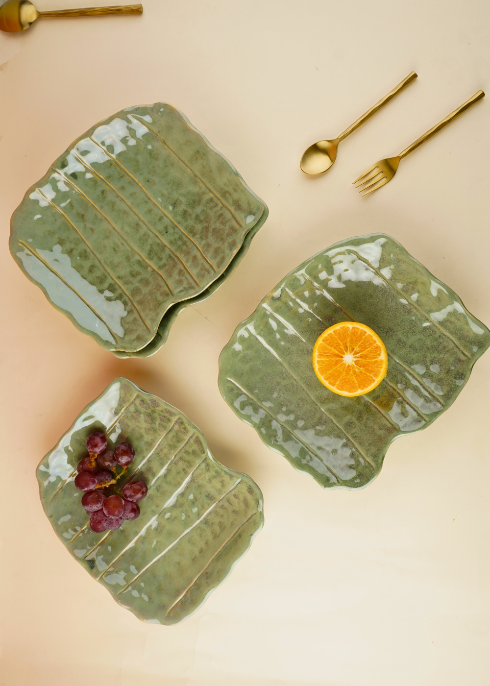 handmade pistachio stoneware platter with golden cutlery