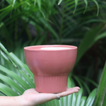 handmade red bloom planter with unique red hue.