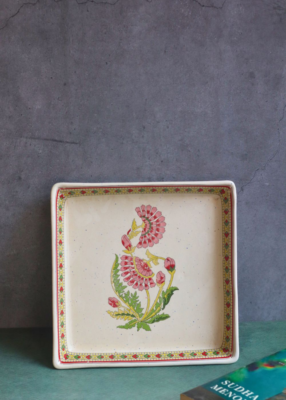 red motif serving platter made by ceramic 