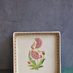 red motif serving platter made by ceramic 