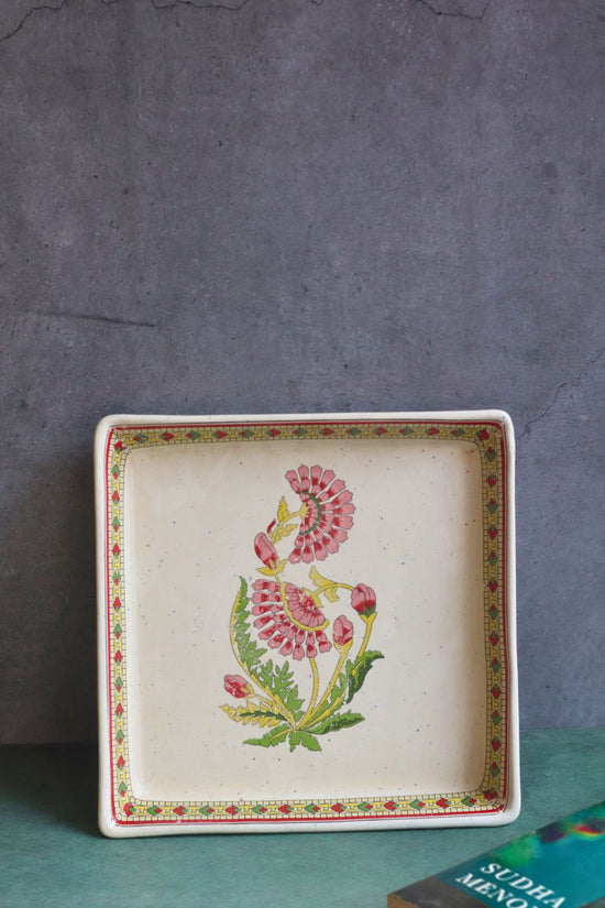 red motif serving platter made by ceramic 