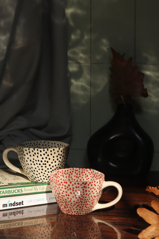 red & black polka mugs made by ceramic 