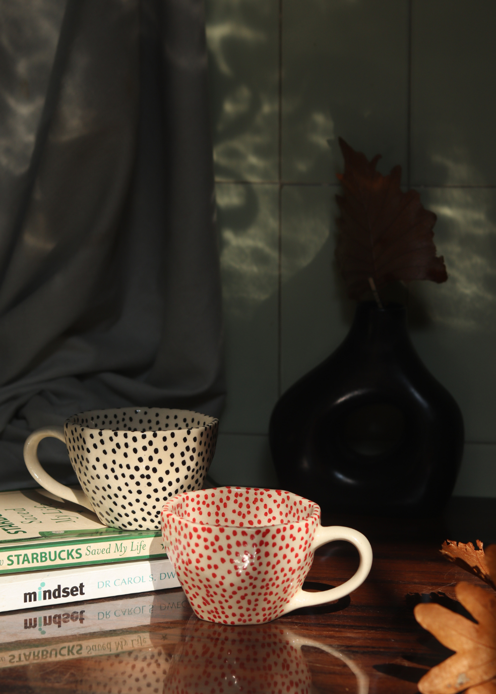 red & black polka mugs made by ceramic 