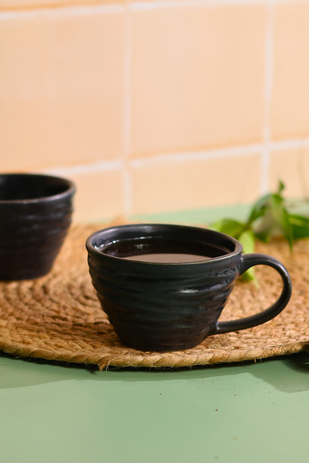 bold black color coffee mug with coffee