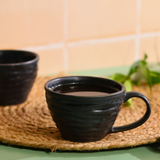 bold black color coffee mug with coffee