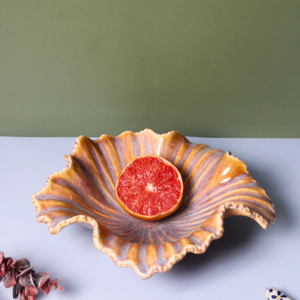 Autumn leaf bowl with orange fruit