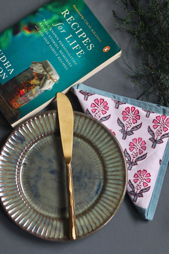 Serveware handmade knife on plate with book 