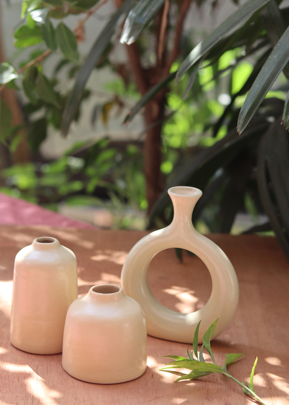 cream bud vase made by ceramic 