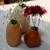 Three handmade ceramic mistif vases with flowers