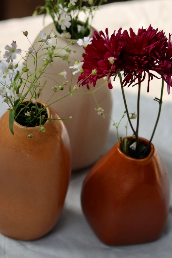 Three handmade ceramic mistif vases with flowers