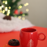 handmade red christmas tree mug with delicious dessert