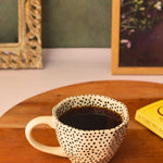 black polka mug with black & white color 