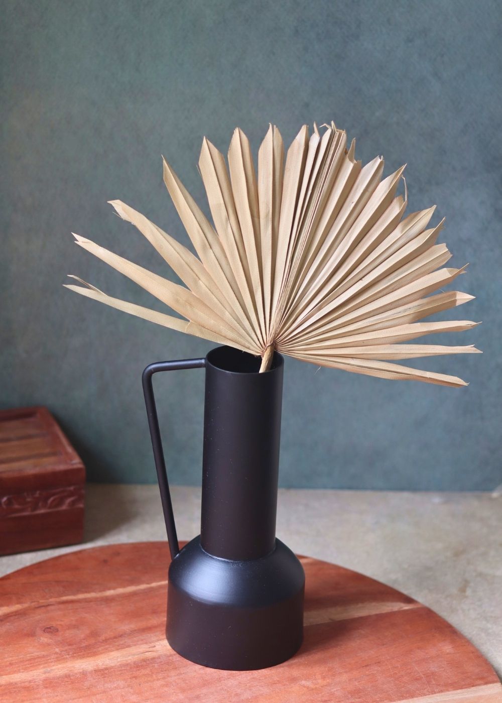 black tall vase made by metal