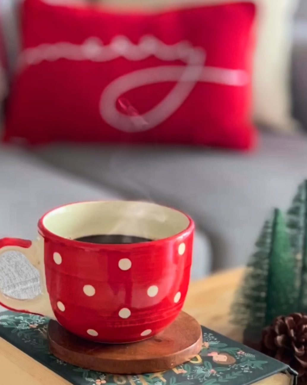 Red and white mug with black tea