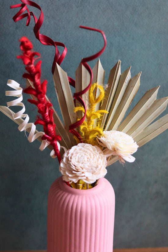 this vase With Assorted bunch made by handcrafted
