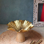 golden cake stand made by metal