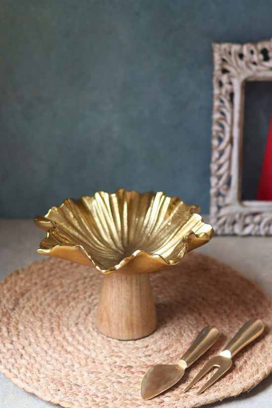 golden cake stand made by metal