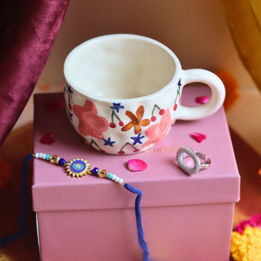  Rakhi Bloom Mug gift box with Rakhi & Earrings is crafted only for this rakhsha bandhan