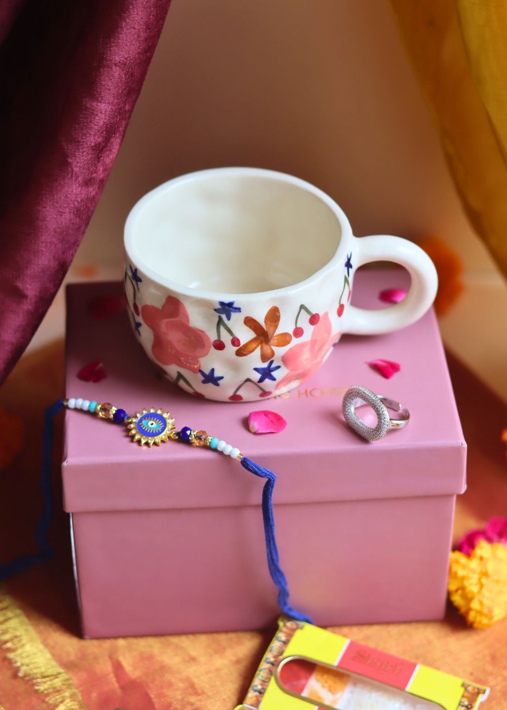  Rakhi Bloom Mug gift box with Rakhi & Earrings is crafted only for this rakhsha bandhan