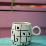 handmade black heart chequered cuddle mug made by ceramic