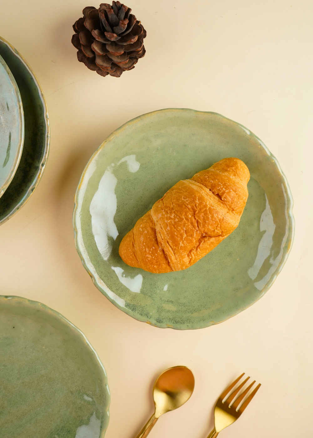 ceramic pistachio stoneware quarter plate with golden cutlery