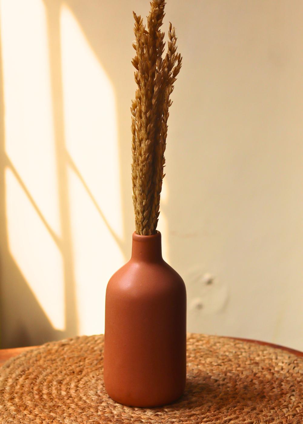 Ceramic caramel vase with dried bouquet 