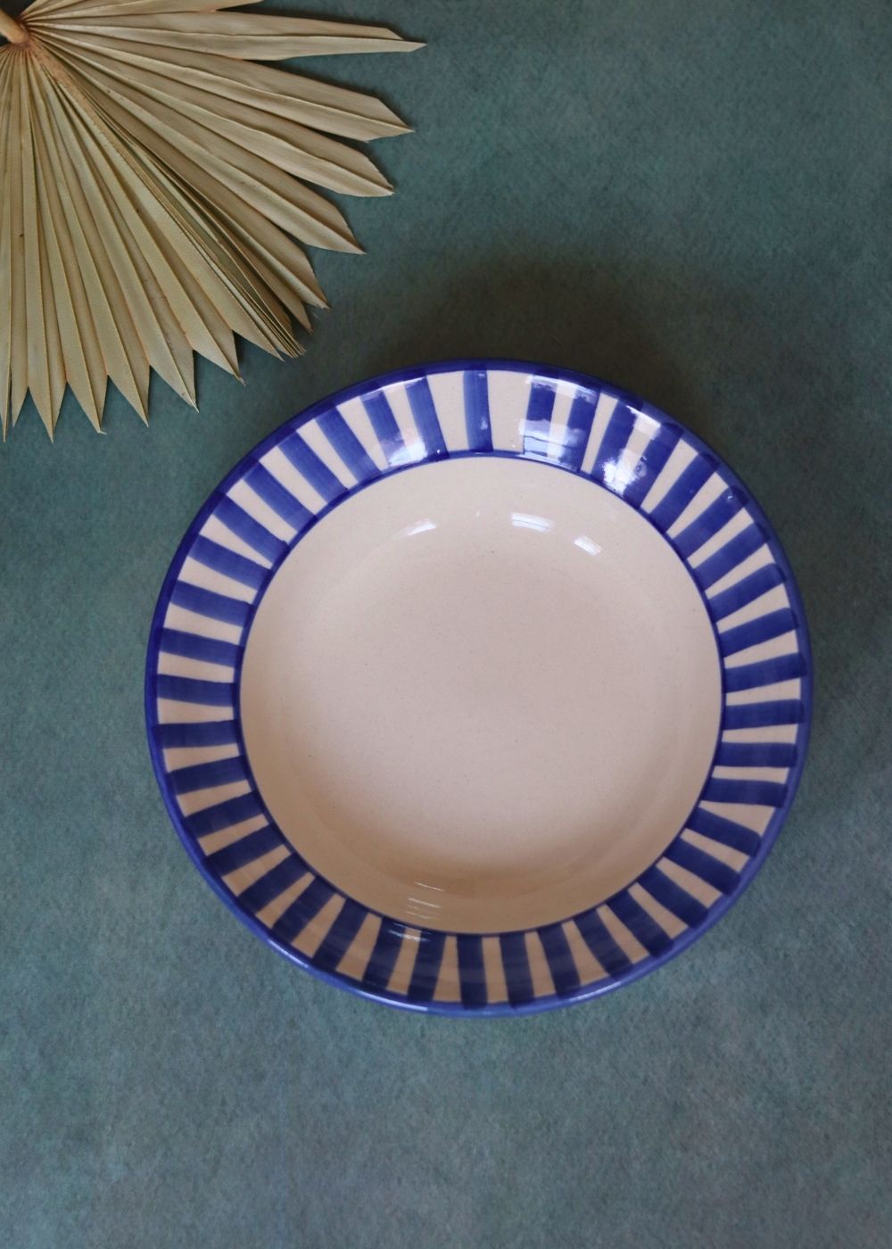 Handmade blue striped pasta plate