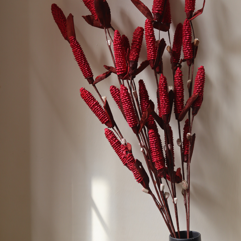 Dried red pine chain bouquet in vase